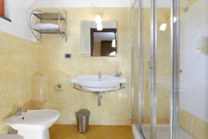 a bathroom with a sink and a shower at B&B Villa Rodriguez in Milazzo