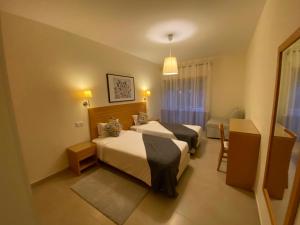 Postel nebo postele na pokoji v ubytování Villas Mare Residence + 37 fotografií