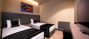 Cama ou camas em um quarto em MENALO HOTEL PREMIUM ISTANBUL AIRPORT
