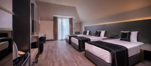 Cama ou camas em um quarto em MENALO HOTEL PREMIUM ISTANBUL AIRPORT