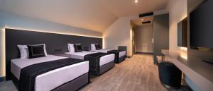 Cama ou camas em um quarto em MENALO HOTEL PREMIUM ISTANBUL AIRPORT