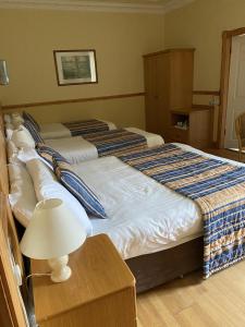 Letto o letti in una camera di O'Shea's Hotel
