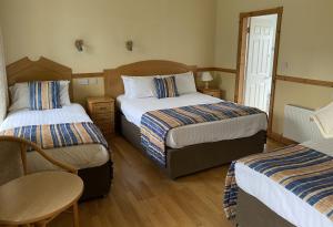 Letto o letti in una camera di O'Shea's Hotel