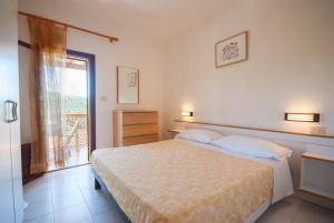 A bed or beds in a room at Residence La Valdana