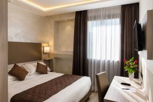 Postel nebo postele na pokoji v ubytování Hotel Plaza