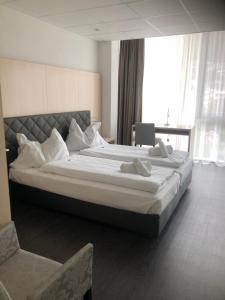 Postel nebo postele na pokoji v ubytování Los Lorentes Hotel Bern Airport