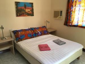 Кровать или кровати в номере Anns Guesthouse BakauGambia