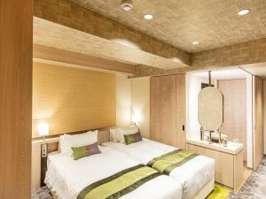Hotel Musse Kyoto Shijo Kawaramachi Meitetsu客房内的一张或多张床位