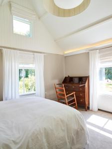 Ein Bett oder Betten in einem Zimmer der Unterkunft Cottage Duinroos - Dune Rose