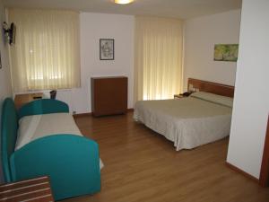 Postel nebo postele na pokoji v ubytování Hotel Scaranò + 33 fotografií