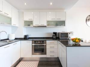 A kitchen or kitchenette at Apartment Club Nautic-22 by Interhome