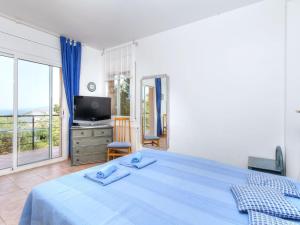Llit o llits en una habitació de Holiday Home Niviroma by Interhome