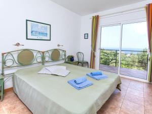 Postel nebo postele na pokoji v ubytování Holiday Home Niviroma by Interhome