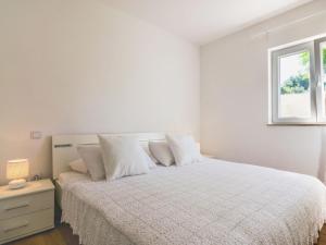 Postel nebo postele na pokoji v ubytování Apartment Villa 2 Pools-1 by Interhome