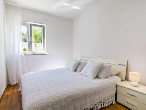 Postel nebo postele na pokoji v ubytování Apartment Villa 2 Pools-1 by Interhome