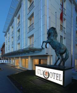 a statue of a lion in front of a hotel at Atli Hotel Ankara in Ankara