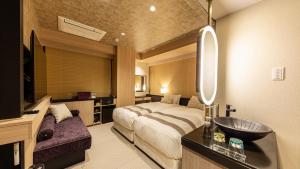 Hotel Musse Kyoto Shijo Kawaramachi Meitetsu客房内的一张或多张床位