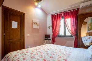 Postel nebo postele na pokoji v ubytování La Suite del Borgo