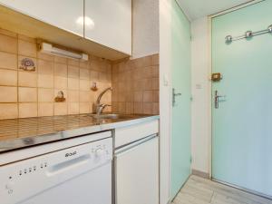 a kitchen with a sink and a shower at Apartment Soyouz Vanguard-80 by Interhome in Le Corbier