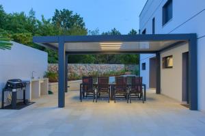 Patio nebo venkovní prostory v ubytování Villa Dama