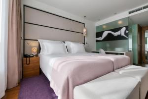 Postel nebo postele na pokoji v ubytování Adriana Hvar Spa Hotel