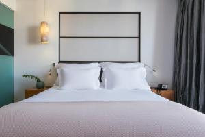 Postel nebo postele na pokoji v ubytování Adriana Hvar Spa Hotel