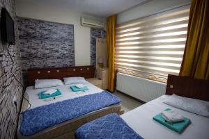 Postel nebo postele na pokoji v ubytování Otel 22 Edirne