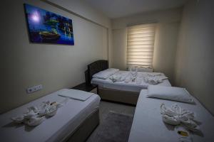 Postel nebo postele na pokoji v ubytování Otel 22 Edirne