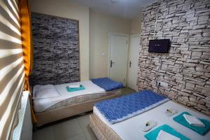 Postel nebo postele na pokoji v ubytování Otel 22 Edirne