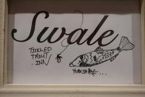 a drawing of a fish hooked up to a hook at The Tickled Trout Inn Bilton-in-Ainsty in York