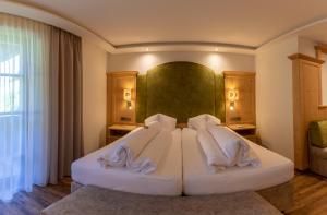 Łóżko lub łóżka w pokoju w obiekcie Hotel Dornauhof