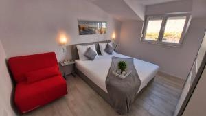 Posteľ alebo postele v izbe v ubytovaní Apartments DaMa