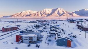 snow covered mountains and a mountain range at Svalbard Hotell | Polfareren in Longyearbyen