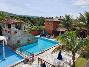 Výhľad na bazén v ubytovaní Villaê Pousada alebo v jeho blízkosti