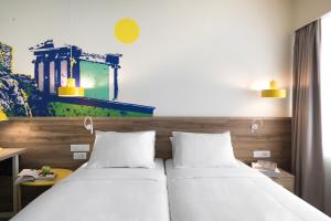 Postel nebo postele na pokoji v ubytování ibis Styles Athens Routes