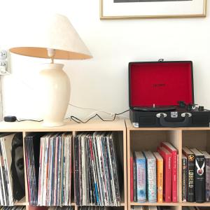 a lamp sitting on top of a book shelf with a laptop at Apple Cottage in Vejby