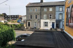 a building with a car parked next to a street at 37A Parker House in Salisbury