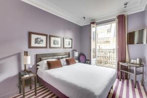 Posteľ alebo postele v izbe v ubytovaní Hotel Duret Paris
