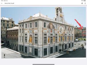 a large white building with a clock tower on top at Palazzo San Giorgio ( S ) in Genova