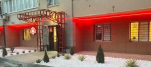 a red building with a fire escape on the side of it at Hotel A3 in Kislovodsk