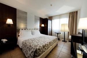 Postel nebo postele na pokoji v ubytování Grand Hotel Admiral Palace