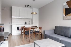 a living room with a couch and a table at Griffintown Hôtel in Montreal