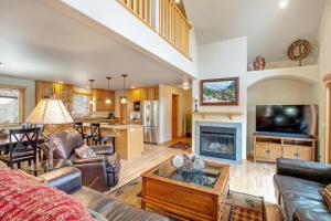 a large living room with a couch and a tv at Retreat By The Rockies #3149 in Estes Park