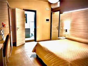 a bedroom with a large bed in a room at Hotel Stella in Modena