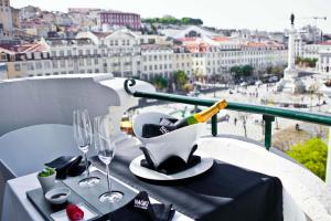 a coffee cup sitting on top of a white counter top at Internacional Design Hotel in Lisbon