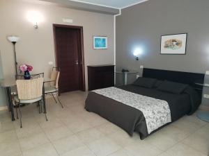 Säng eller sängar i ett rum på Residence La Palma