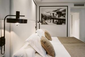 A bed or beds in a room at Hotel Abando