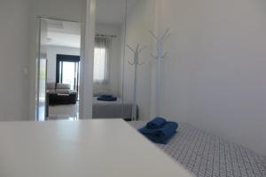 Ένα ή περισσότερα κρεβάτια σε δωμάτιο στο White luxury apartment +67 φωτογραφίες