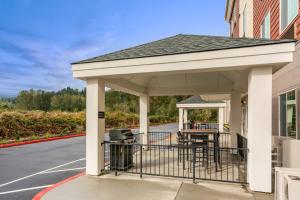 a pavilion on the side of a building at Candlewood Suites Sumner Puyallup Area, an IHG Hotel in Sumner