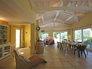 a large living room with a table and chairs at Tranquil Villa in Bargemon with Private Pool in Bargemon